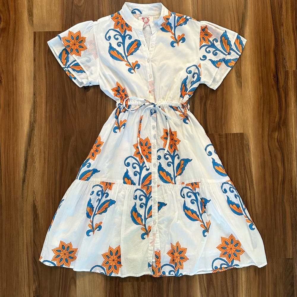 Victoria Dunn White, orange and blue flutter sleeve dress.